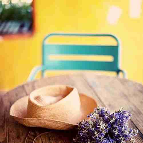 Image of a holiday cottage with hat and lavender